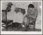 Mrs. Gallagher patching clothes for her children. Wife of former farmer, now living in Crosby, North Dakota