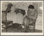 Mrs. Gallagher patching clothes for her children. Wife of former farmer, now living in Crosby, North Dakota