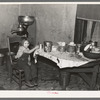 Daughter of John Baker in kitchen of the farm home, Divide County, North Dakota