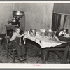 Daughter of John Baker in kitchen of the farm home, Divide County, North Dakota