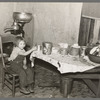 Daughter of John Baker in kitchen of the farm home, Divide County, North Dakota