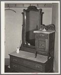 Old dresser in home of Jim Hardin, former promoter. Two Bit Creek, near Deadwood, South Dakota