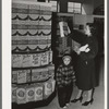 Resident at Greenbelt with child in the Greenbelt cooperative grocery store, Maryland