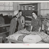 Southeast Missouri Farms. Customers examining yard goods in cooperative store. La Forge project, Missouri