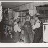 Southeast Missouri Farms. Farmers talking together in cooperative store, La Forge project, Missouri