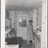 Southeast Missouri Farms. Sharecropper's wife in kitchen of new home. La Forge project, Missouri