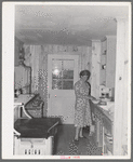 Southeast Missouri Farms. Sharecropper's wife in kitchen of new home. La Forge project, Missouri