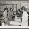 Southeast Missouri Farms. Examining yard goods in cooperative store, La Forge project, Missouri