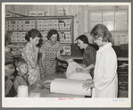 Southeast Missouri Farms. Examining yard goods in cooperative store, La Forge project, Missouri
