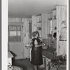Southeast Missouri Farms. Wife of client in kitchen of new home, La Forge project, Missouri