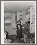 Southeast Missouri Farms. Wife of client in kitchen of new home, La Forge project, Missouri