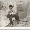 Southeast Missouri Farms. Son of sharecropper dressing in combination bedroom and corn crib