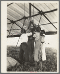 Tightening ropes in raising circus tent. Lasses-White traveling show, Sikeston, Missouri