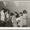 Children choosing books from the small school library near La Forge, Missouri. Southeast Missouri Farms school