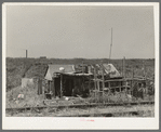 Shack on the other side of the railroad tracts, looking toward the levee. Tin Town, Caruthersville, Missouri