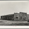 Old warehouse, once the station for early Mississippi River steamboat travel, Caruthersville, Missouri, now inhabited by squatters