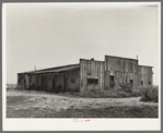 Old warehouse, once the station for early Mississippi River steamboat travel, Caruthersville, Missouri, now inhabited by squatters