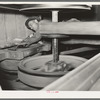 Oiling bearings of pulleys. State rice mill, Crowley, Louisiana. Note absence of guards