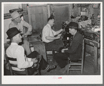 In the shoe repair shop. San Augustine, Texas