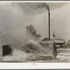 Burning pile of sawdust at sawmill at Wells, Texas