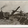Steam shovel at work at paper mill. Lufkin, Texas