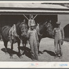 FSA (Farm Security Administration) clients with team in front of barn. Sabine Farms, Marshall, Texas