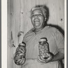 Wife of FSA (Farm Security Administration) client with home-canned vegetables. Sabine Farms, Marshall, Texas