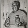 Wife of FSA (Farm Security Administration) client with home-canned vegetables. Sabine Farms, Marshall, Texas