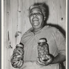 Wife of FSA (Farm Security Administration) client with home-canned vegetables. Sabine Farms, Marshall, Texas