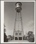 Fire station and water tank. Carthage, Texas