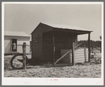 Shed and corner of house on farm unit. Sabine Farms, Marshall, Texas