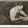 Bootmaker putting last and sole into upper part of boot. Boot shop, Alpine, Texas