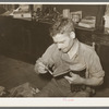 Applying glue before putting on outer sole of boot. Cowboy boot shop, Alpine, Texas