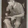 Bootmaker shaping the outer sole to the boot. Cowboy boot shop, Alpine, Texas