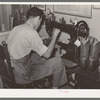 Repairing cowboy boots in boot shop. Alpine, Texas