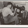 Repairing cowboy boots in boot shop. Alpine, Texas