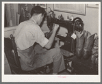 Repairing cowboy boots in boot shop. Alpine, Texas