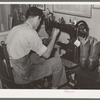 Repairing cowboy boots in boot shop. Alpine, Texas