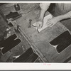 Transferring pattern for stitching on the uppers of the boots. Bootmaking shop, Alpine, Texas