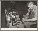 Leather which forms the heel is applied in layers and is filed down for accurate shaping. Boot shop, Alpine, Texas