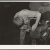 Repairing saddle. Alpine, Texas, saddle shop
