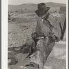 Mexican cowboy eating dinner after the roundup. Cattle ranch near Marfa, Texas