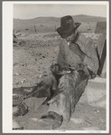 Mexican cowboy eating dinner after the roundup. Cattle ranch near Marfa, Texas