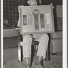 Mr. Henry Fletcher, owner of the "Walking X" Ranch, displaying awards won by his cattle. Marfa, Texas
