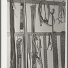 Cinch straps, bits, halters and chains in ranch supply store. Alpine, Texas