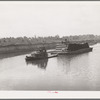 Barge loaded with pipe. Port of Houston, Texas