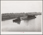Barge loaded with pipe. Port of Houston, Texas