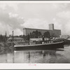 Flour mill and tug. Port of Houston, Texas