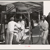 Weighing cotton at the unloading platform. Compress, Houston, Texas