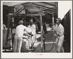 Weighing cotton at the unloading platform. Compress, Houston, Texas